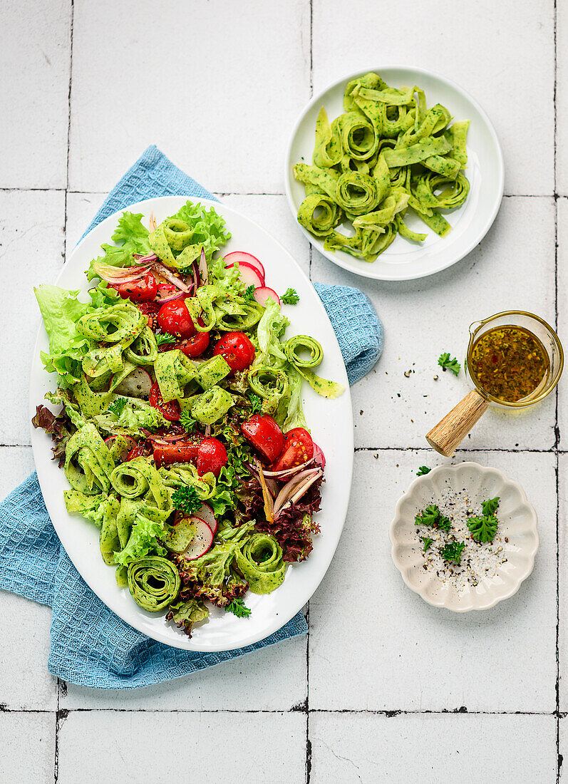 Spring salad of wild garlic crêpe rolls