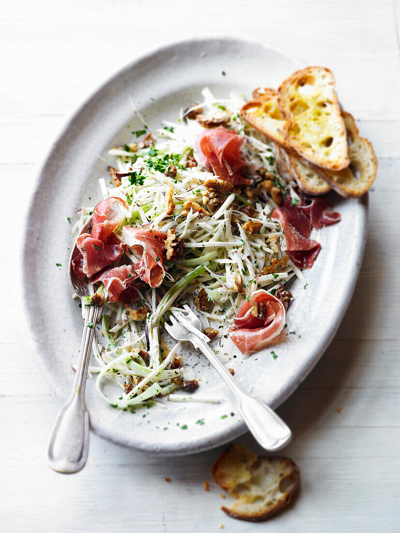 Celery and apple salad with prosciutto and walnuts