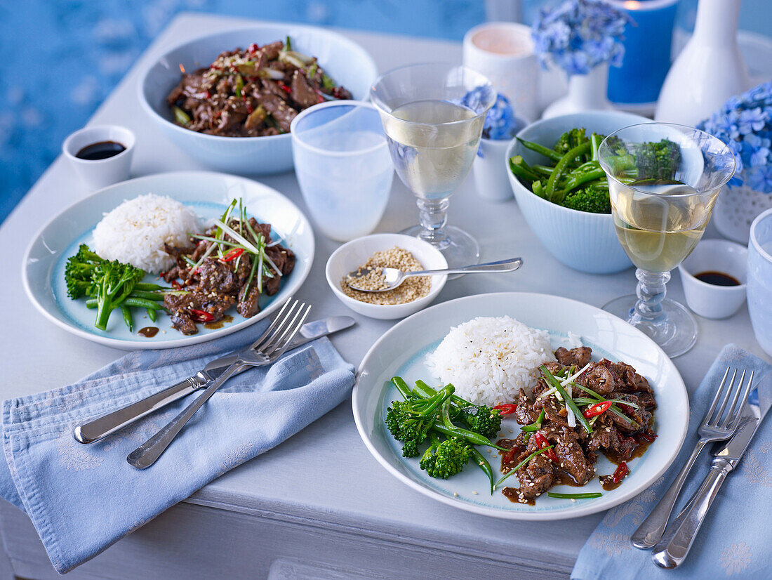 Korean style beef with rice, sesame seeds, and broccolini