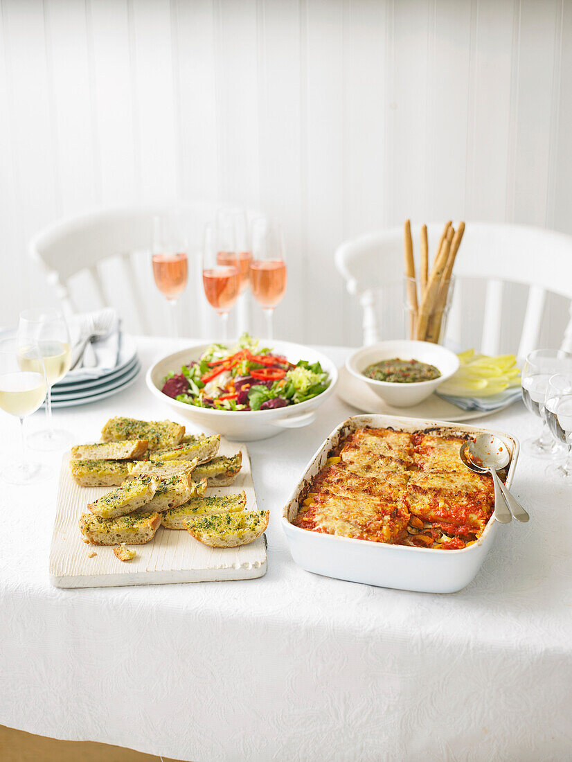 Italian vegetable menu – cannelloni with pumpkin tomatoes, pesto with chicory, salad, focaccia