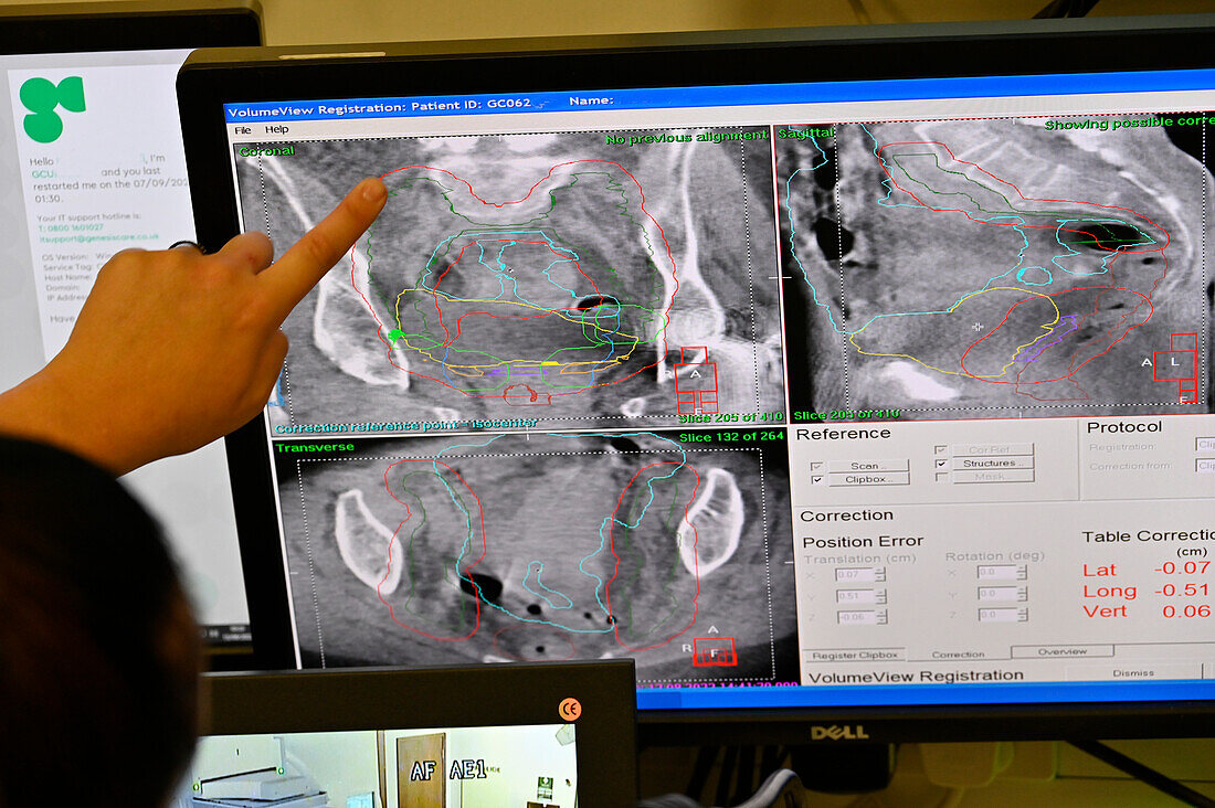Radiologist monitoring patient undergoing radiotherapy
