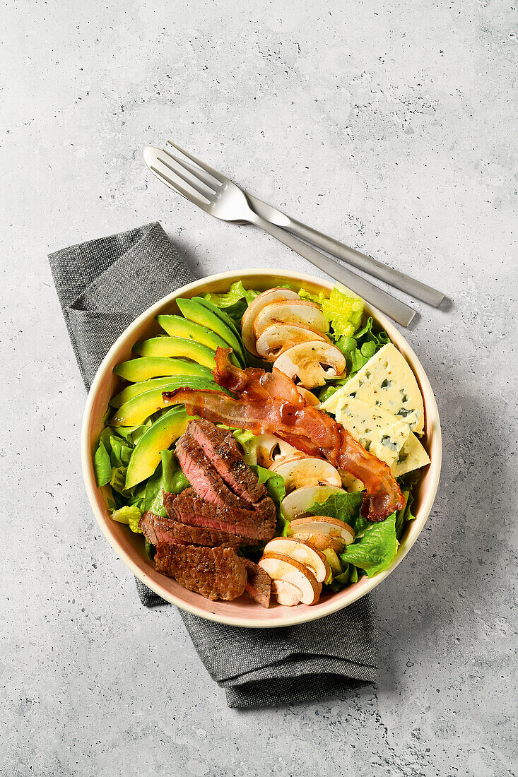 Cobb salad with blue cheese, minute steak, and bacon