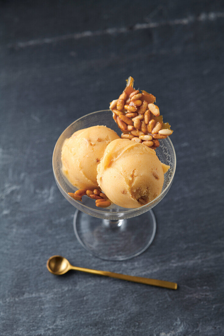Persimmon sorbet with caramelized pine nuts