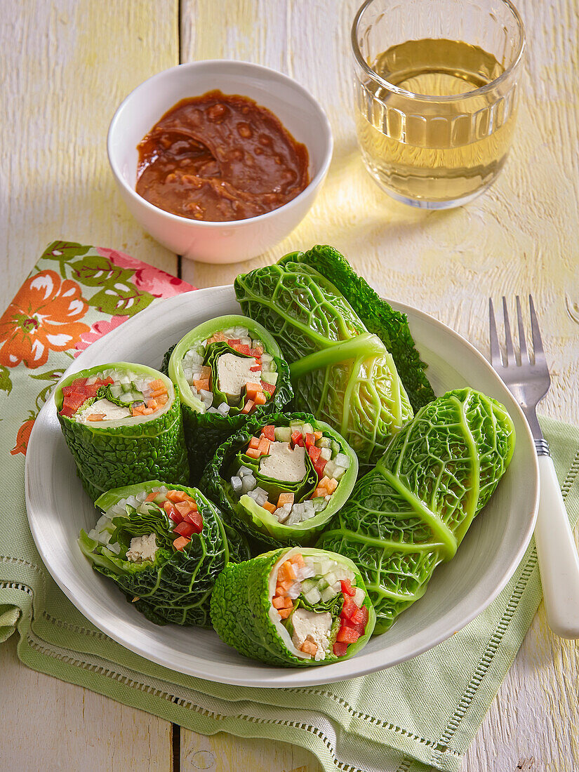 Savoy cabbage rolls stuffed with tofu and wild garlic