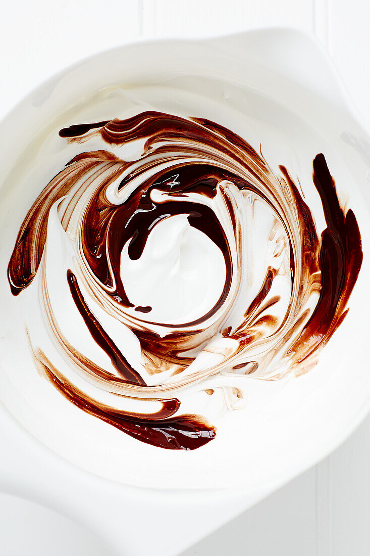 Stirring chocolate into meringue mixture