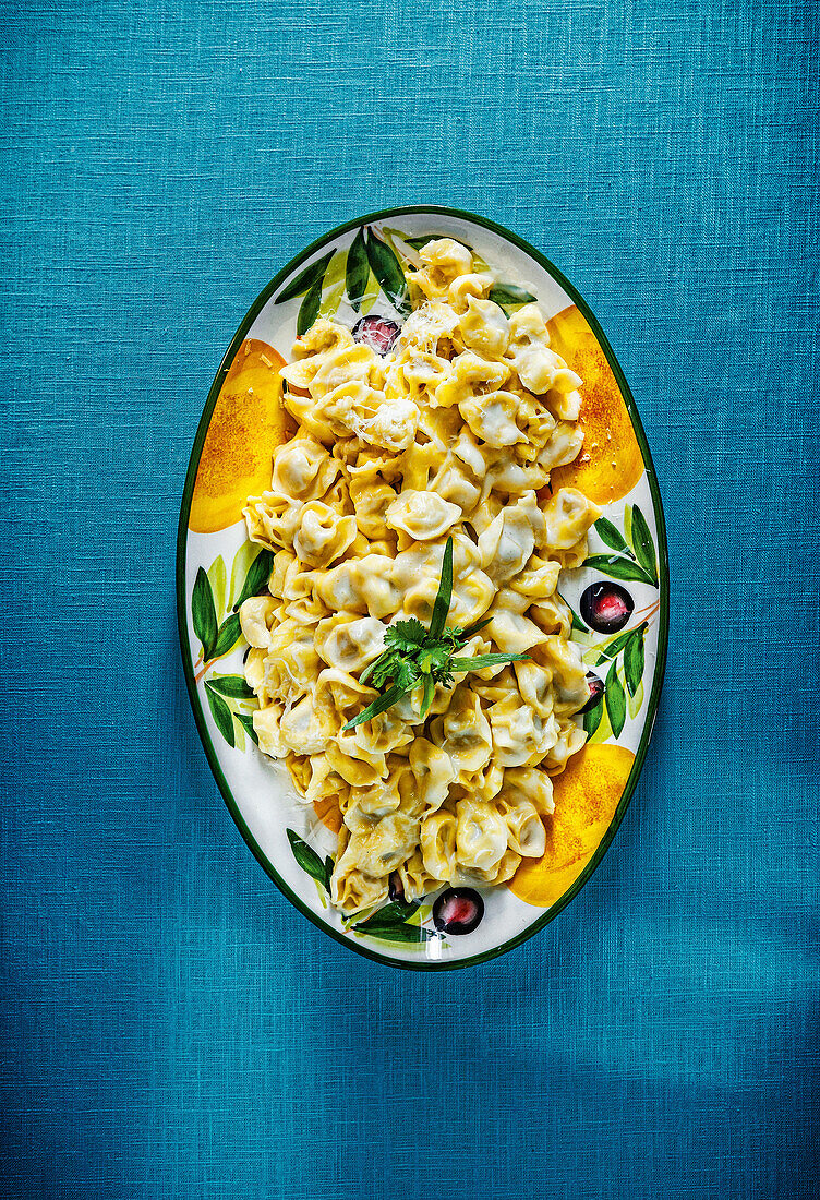 Tortellini filled with prosciutto, mortadella and parmesan sauce