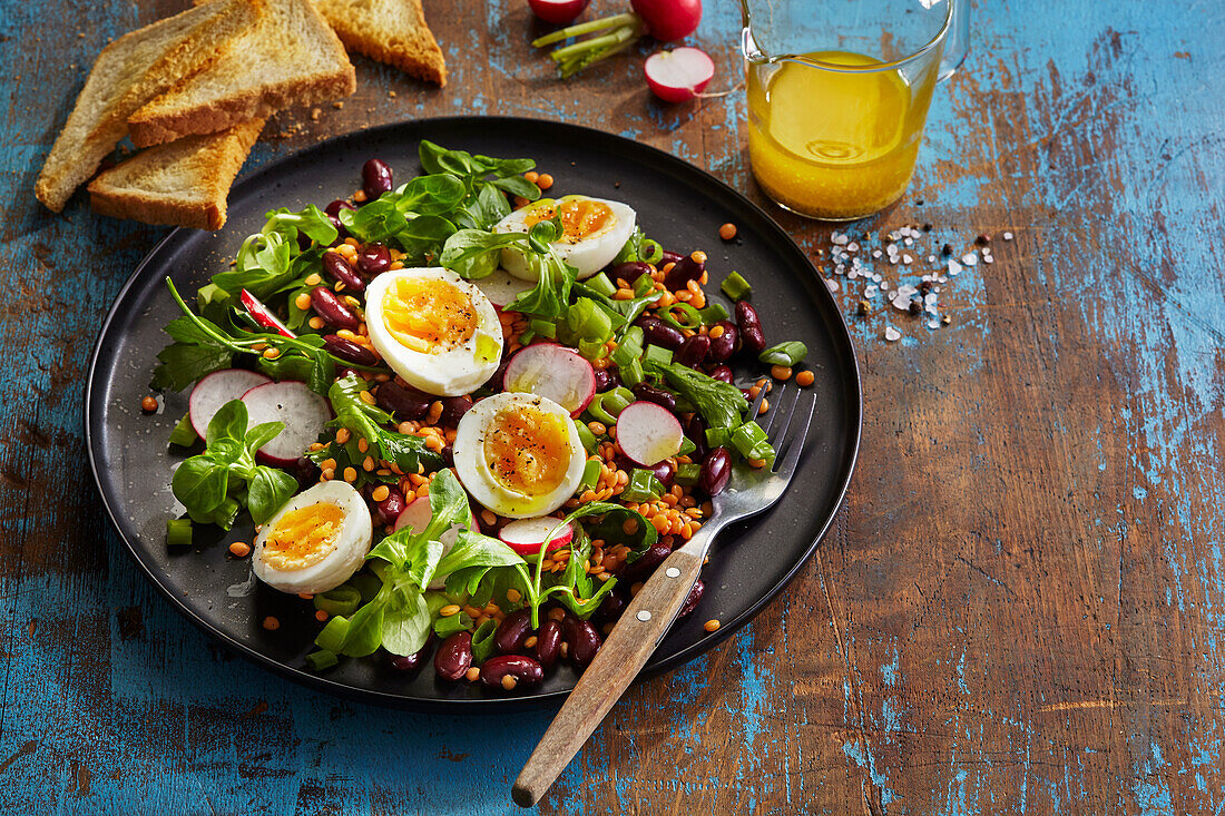 Bean and lentil salad with egg