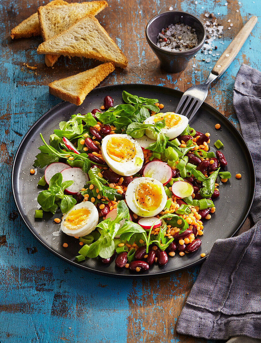 Bean and lentil salad with egg