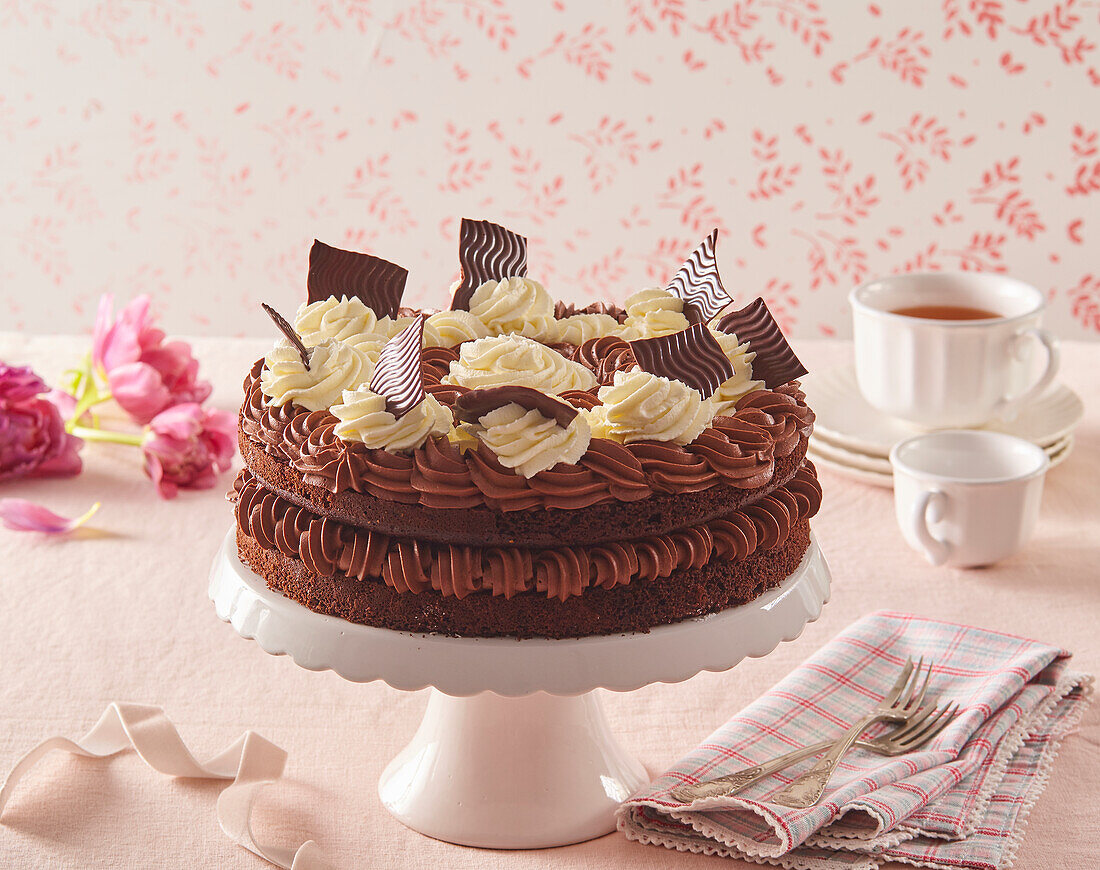 Chocolate cream cake with vanilla cream dollops