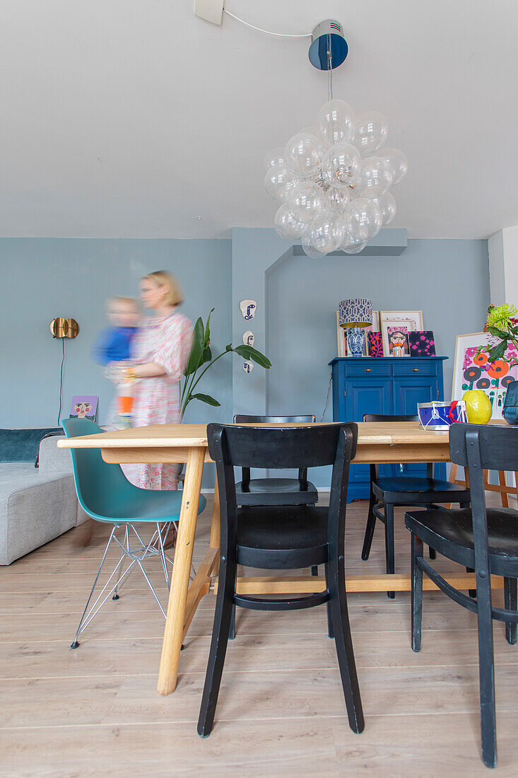 Dining area with colourful interior and pendant light