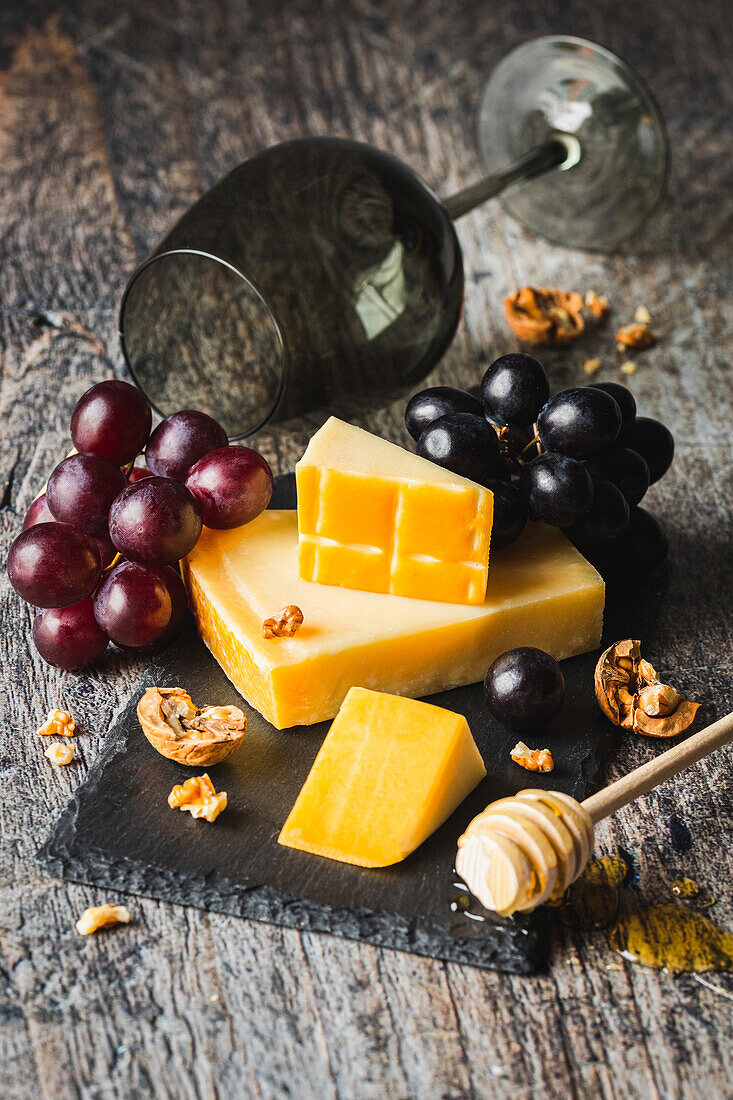 Cheese platter with grapes and walnuts