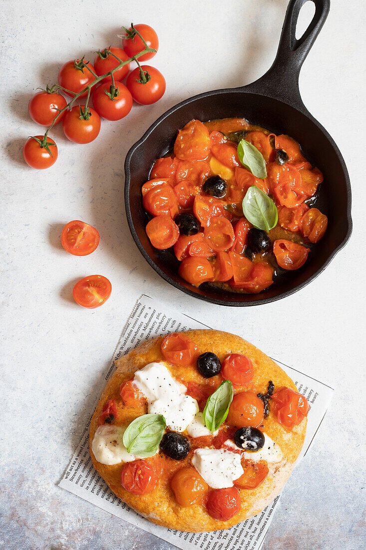 Pizza with tomatoes, mozzarella and olives