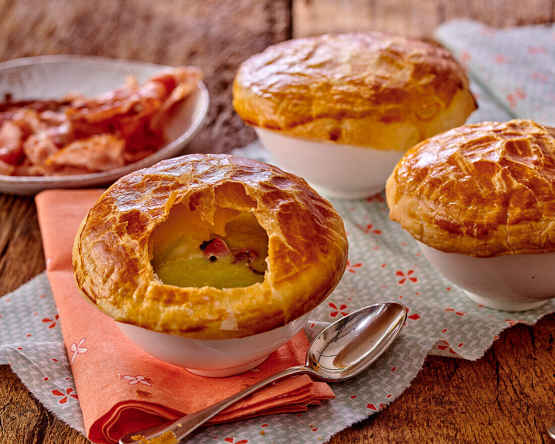 Potato and leek soup under a puff pastry cover