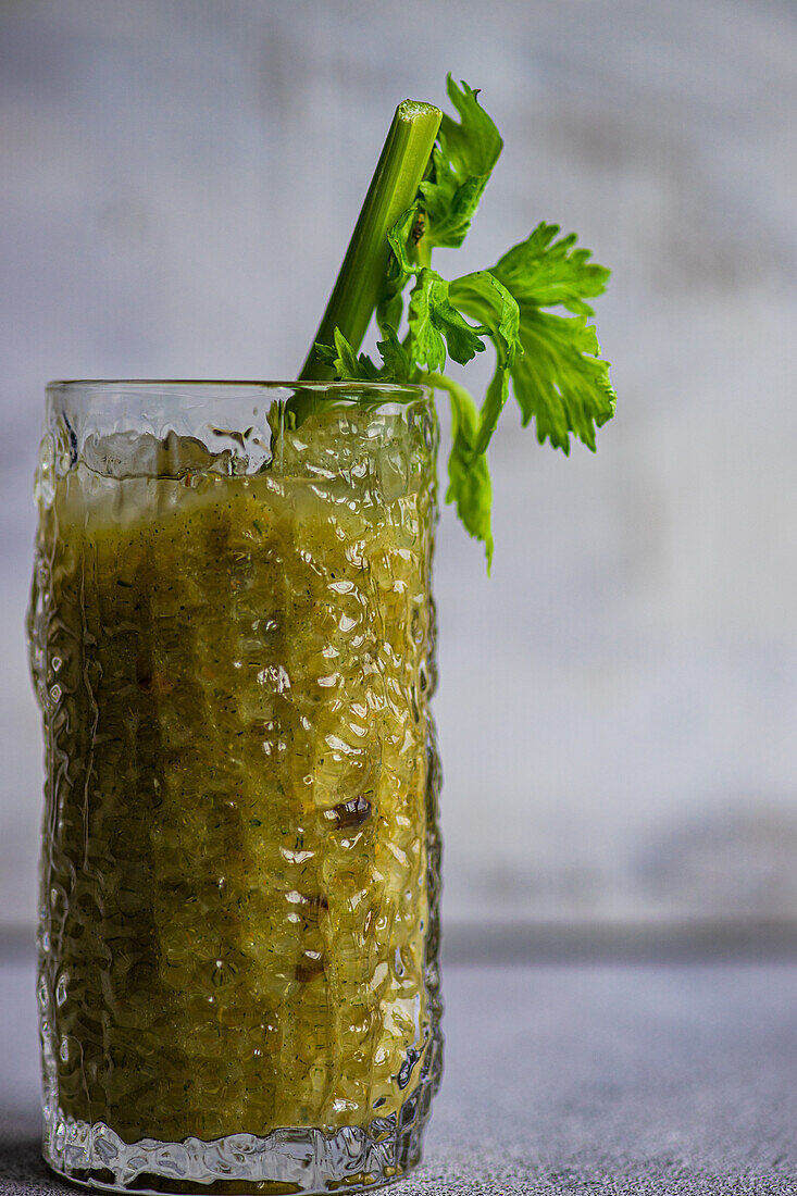 Vegetable smoothie with celery stalks