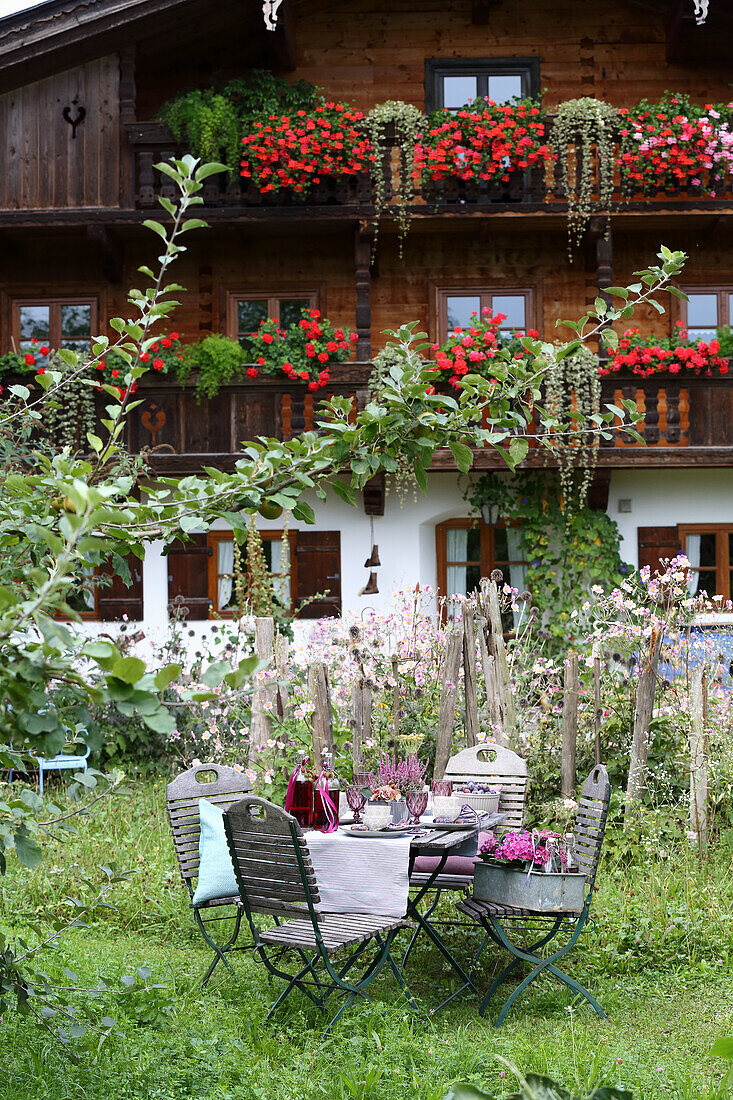 Autumn garden table in front of a farmhouse, Bavaria, Germany