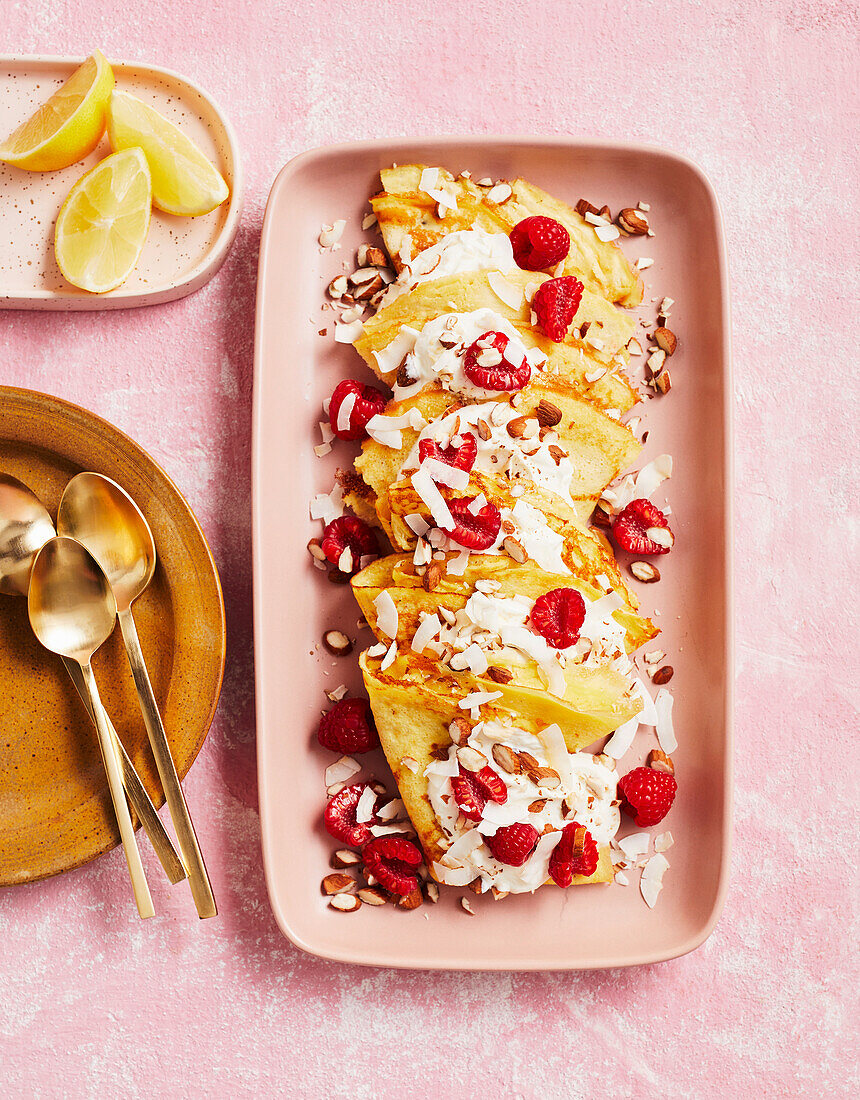 Chia crepes with raspberries and flaked coconut