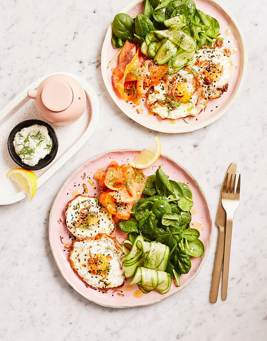 Breakfast plate with fried eggs and smoked salmon