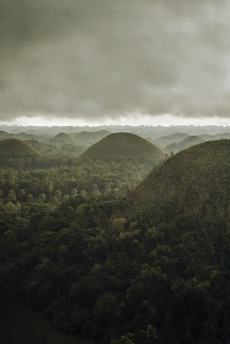 Chocolate Hills Landscape From Bohol Island, A Big Storm Covers The Sky Making An Interesting Lighting Effect; Carmen, Bohol Island, Philippines