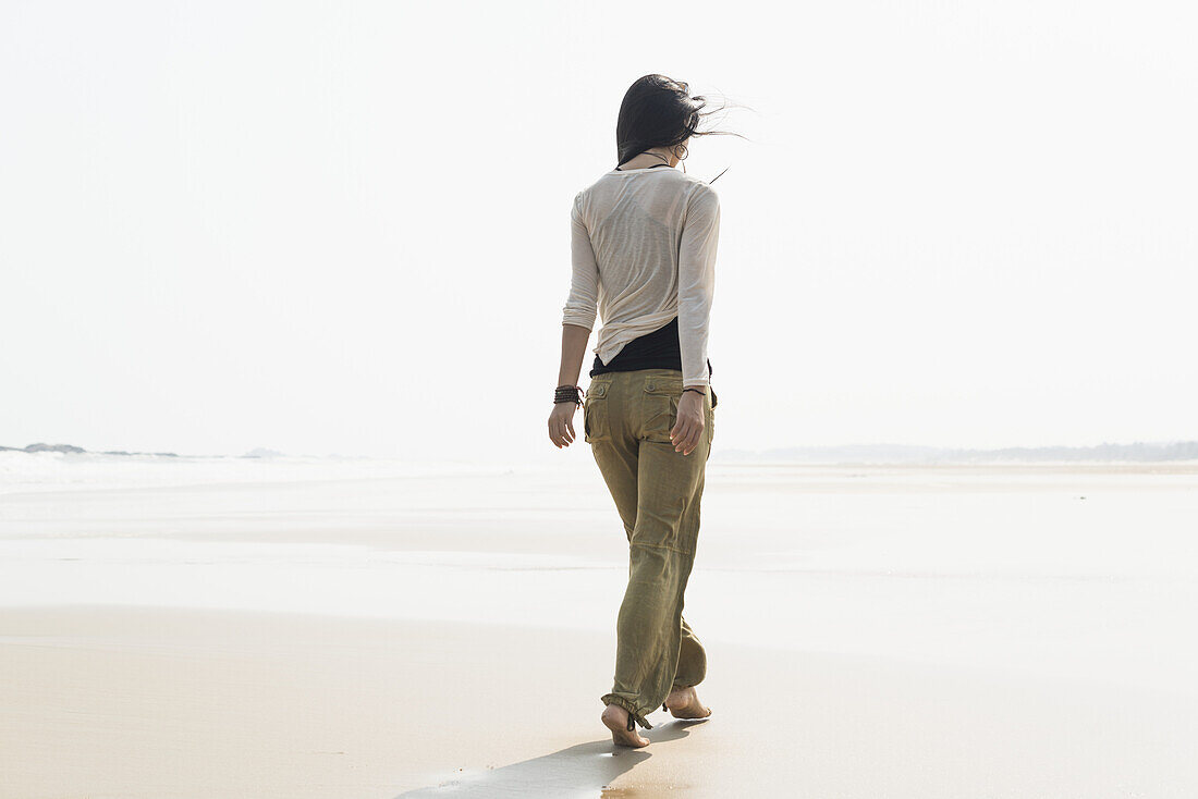 Young Woman Walking On The Beach; Huohu, Taiwan