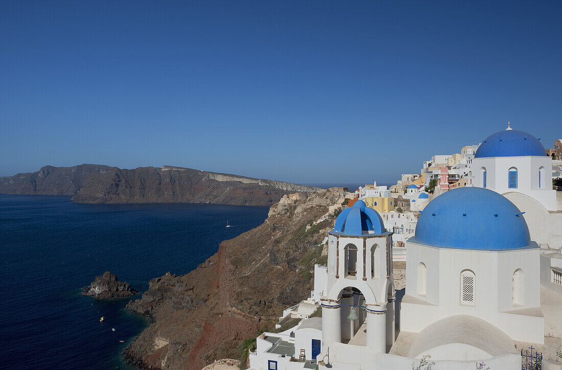 Blue Domed Churches On A Cliff Overlooking The Caldera; Oia, Santorini, Cyclades, Greek Islands, Greece