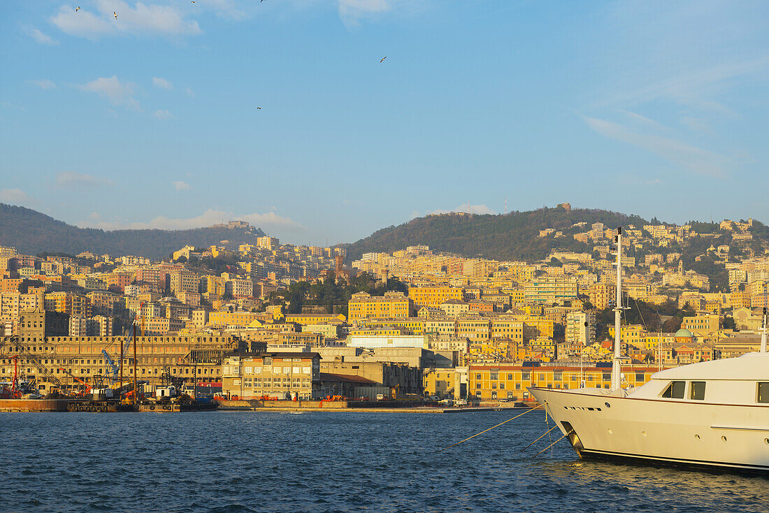 Boats In The Harbour And Buildings On The Waterfront; Genoa, Liguria, Italy