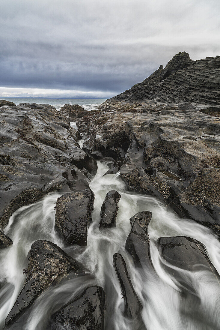 Water Rushes Over The Volcanic Bedrock Around The Area Of Tow Hill On The North Shore Of Haida Gwaii, Naikoon Provincial Park; British Columbia, Canada