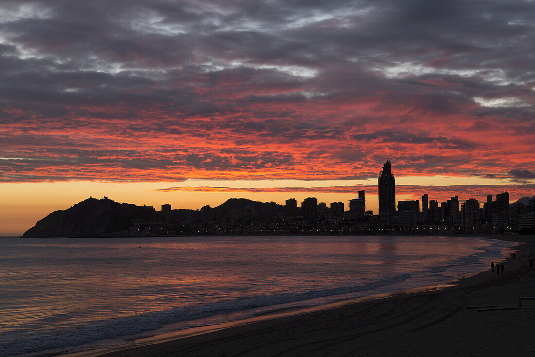 Colourful Dramatic Sunset Over The Silhouetted Skyline; Benidorm, Spain