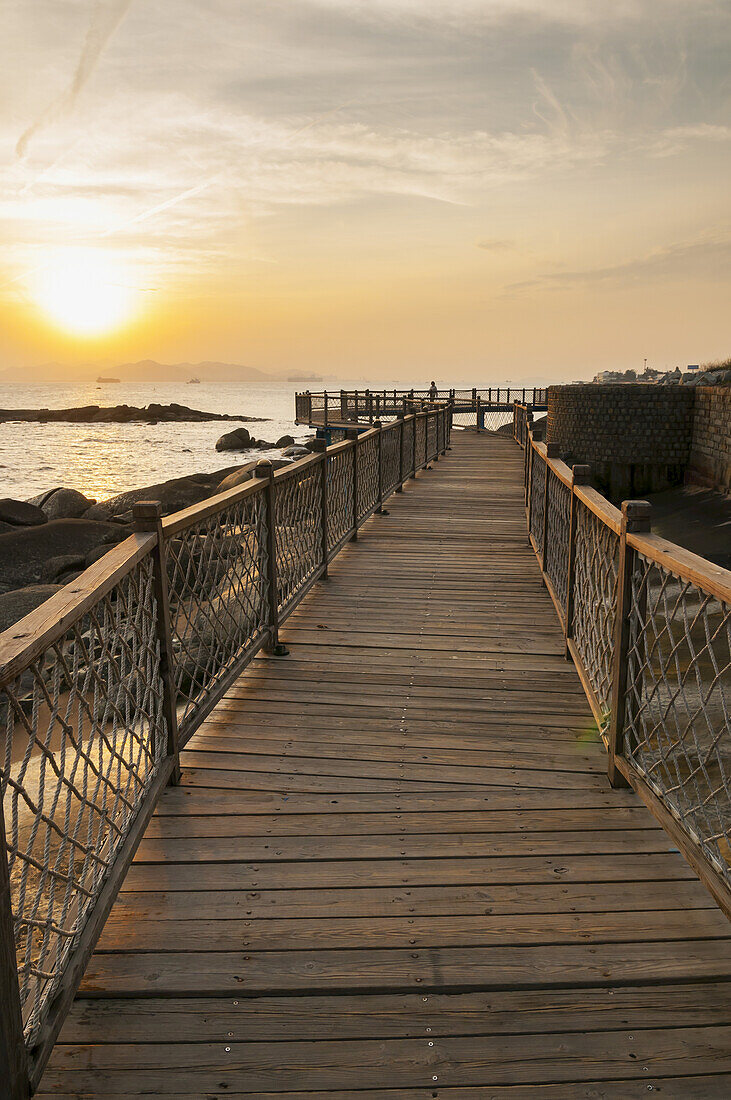 Wooden Boardwalk With Railing Along The Water; Xiamen, Fujian, China