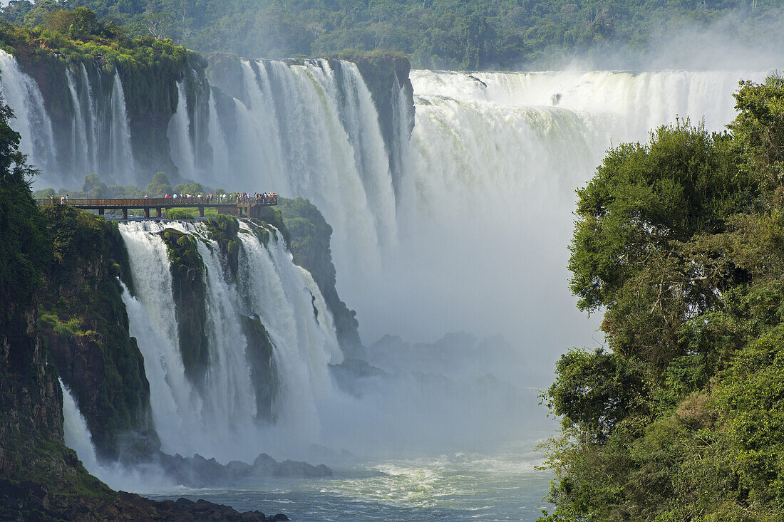 Iguazu Falls With Tourists On A Walkway; Argentina