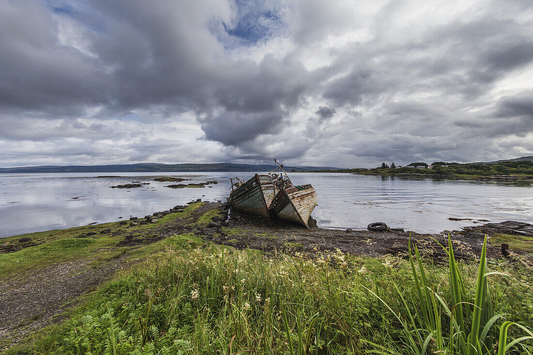 Abandoned Boats Sinking At The Water's Edge