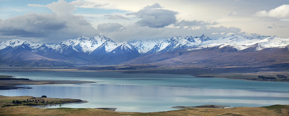 Lake Tekapo, With Snow Covered Mountains; Tekapo, New Zealand