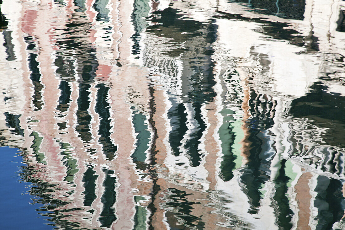 Reflection Of A Building In A Canal; Venice, Italy