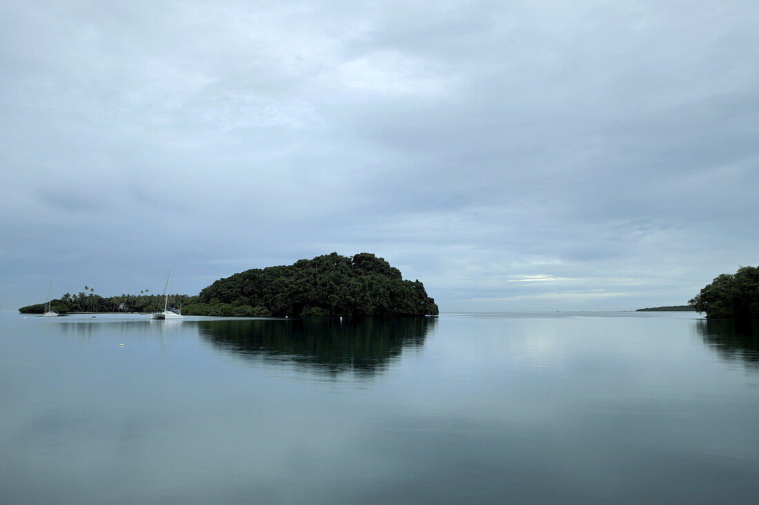 Sailboat Docked Near A Small Island Near Suva, South Pacific; Fiji Island