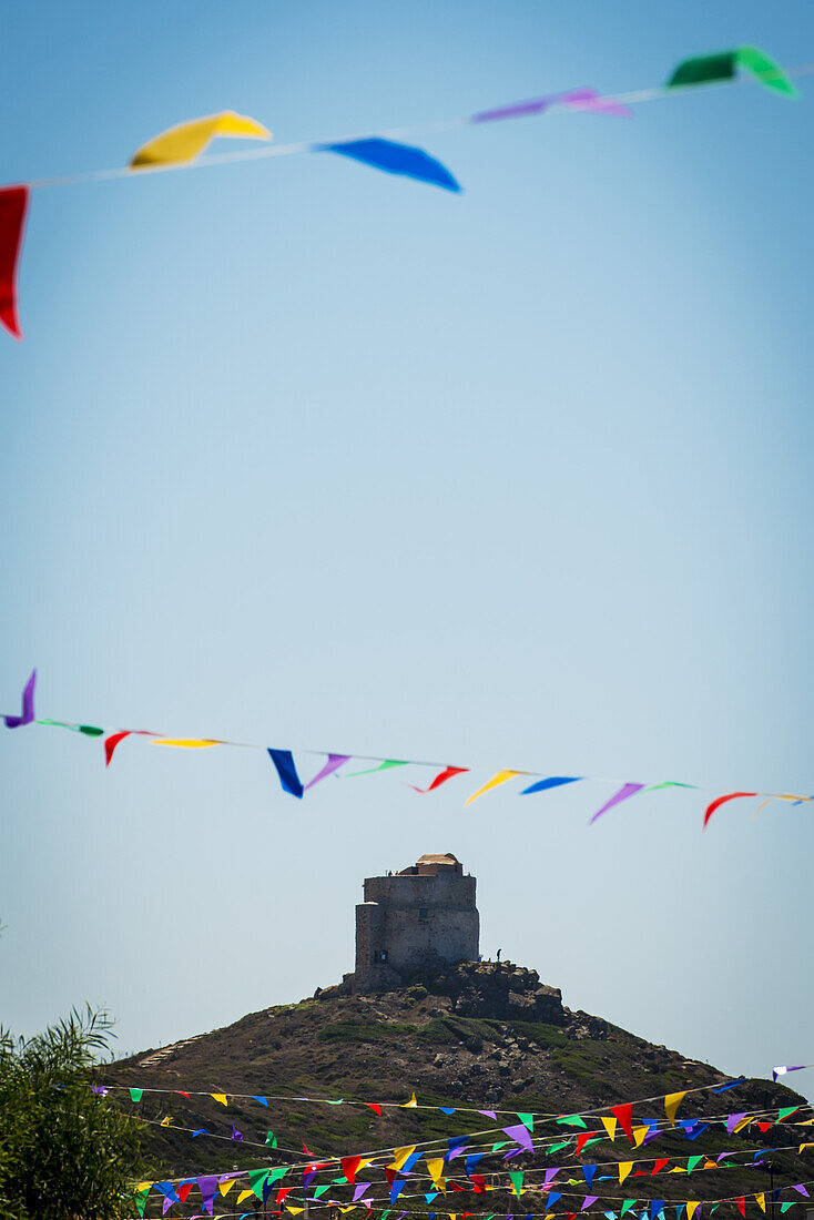 Colourful Bunting And San Giovanni Tower; Sardinia, Italy