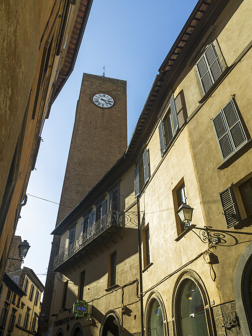 Clock Tower Against A Blue Sky; Orvieto, Umbria, Italy