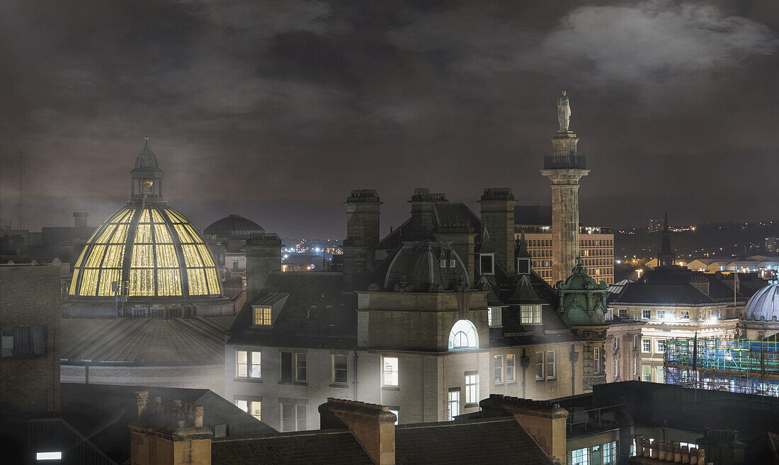 Fog Sets In Over Buildings At Nighttime; Newcastle, Northumberland, England