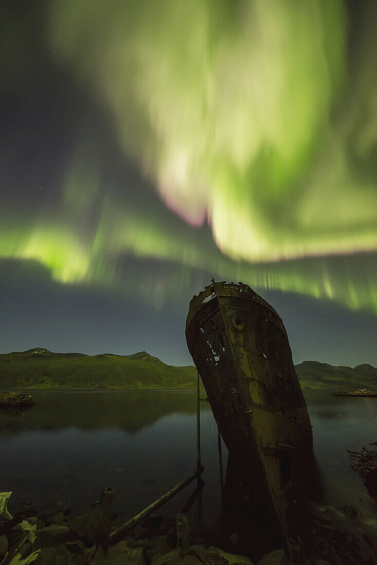Northern Lights Over Top Of The Town Known As Djupavik Along The Strandir Coast, Here They Are Dancing Above The Old Herring Factory And Shipwreck; Djupavik, Iceland