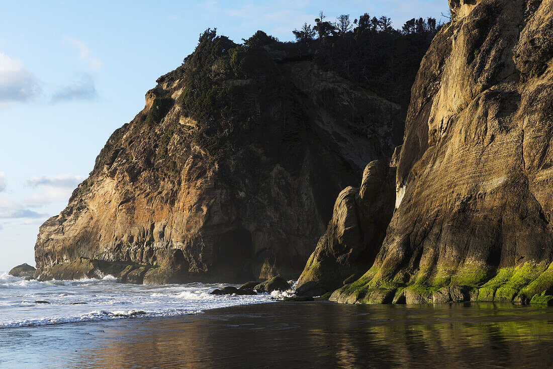 Surf Washes The Beach At Hug Point; Arch Cape, Oregon, United States Of America