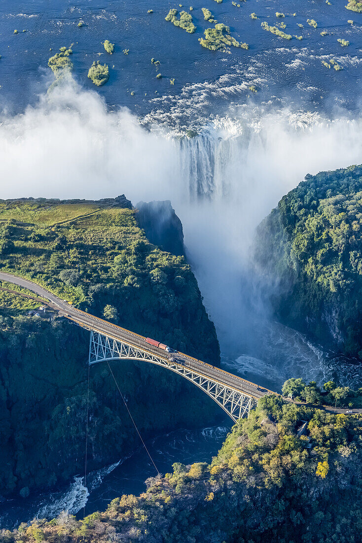 Aerial View Of Victoria Falls Behind Bridge; Botswana