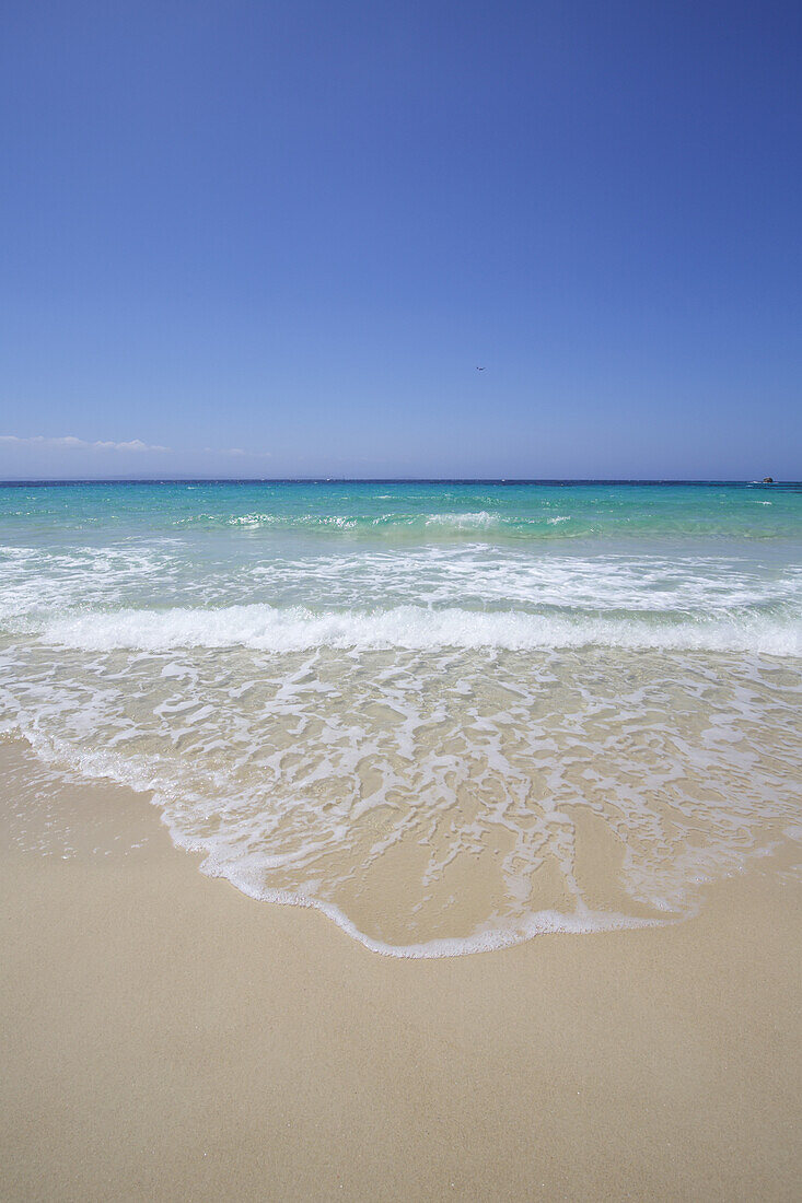 White Sand Island Beach With Crystal Clear Turquoise Water And Blue Sky