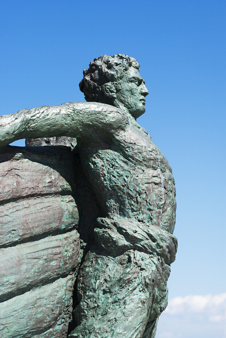 Statue Of A Man Against A Blue Sky On A Greek Island; Panormos, Thessalia Sterea Ellada, Greece