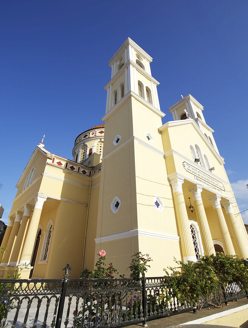 Painted Greek Orthodox Church In Village Setting