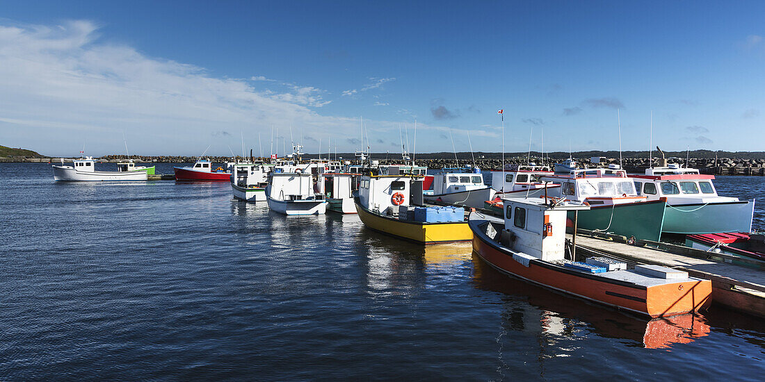 Colourful Fishing Boats In The Harbour; Main-A-Dieu, Nova Scotia, Canada