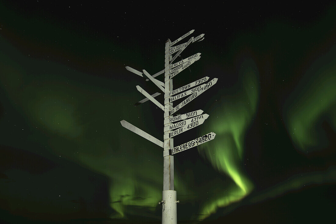 Aurora Borealis In The Sky Above The Signpost On Top Of Keno Hill; Keno, Yukon, Canada