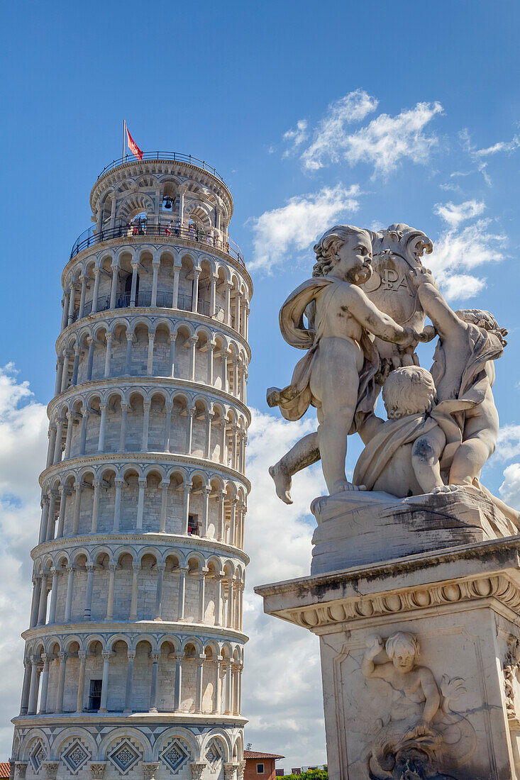Leaning Tower of Pisa and statue; Pisa, Italy