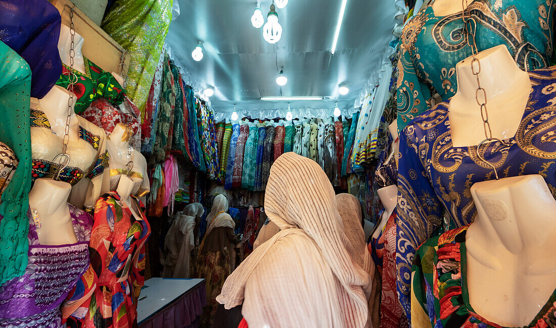Eritrean woman at a clothing shop in the Mercato of the indigenous people; Asmara, Central Region, Eritrea