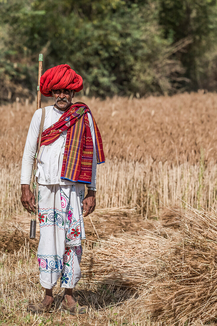 Local man keeping guard over the fields in Northern India; Rajasthan, India