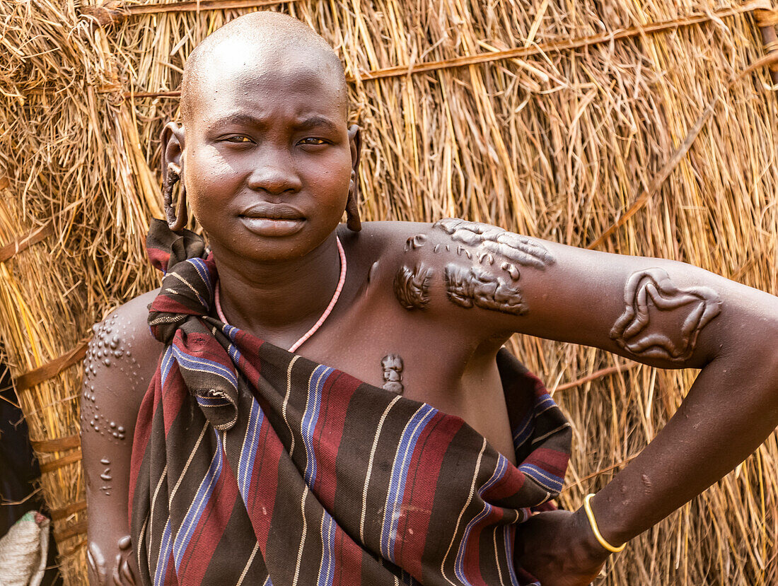 Mursi woman  in a village in Mago National Park, Omo Valley; Southern Nations Nationalities and Peoples' Region, Ethiopia