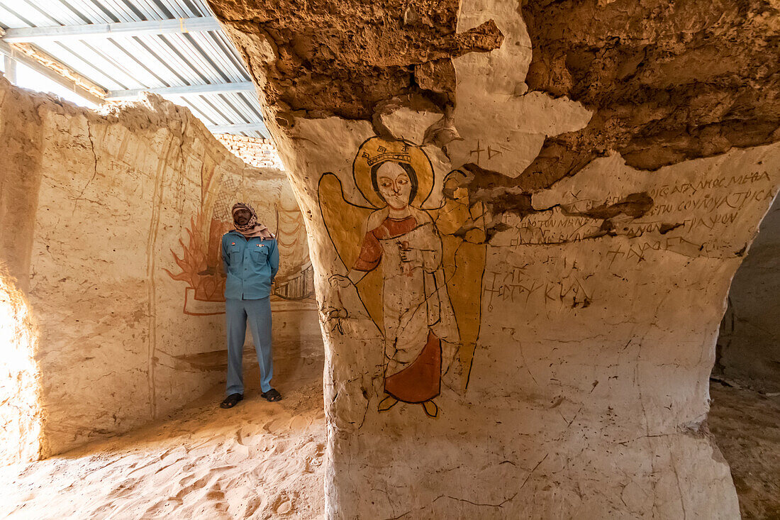 Christian fresco and man standing in the Monastery; Old Dongola, Northern State, Sudan