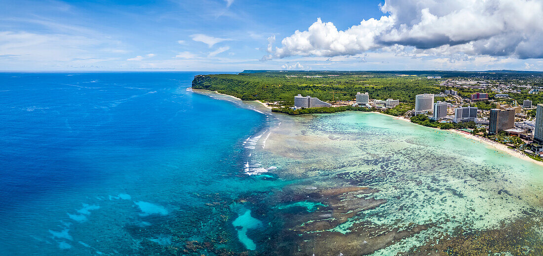 An aerial panorama of the North end of Tumon Bay with it's hotels and beach and Two Lovers Point; Guam, Micronesia